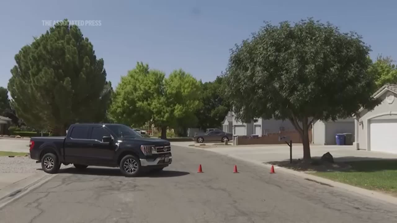 Authorities seen investigating the home of Charlie Kirk shooting suspect