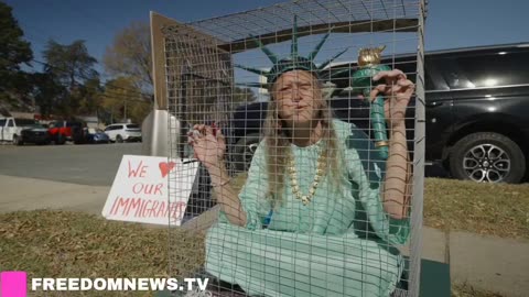 CHARLOTTE: "I'm a humanitarian, I love people" woman inside a cage dressed as Statue of Liberty,