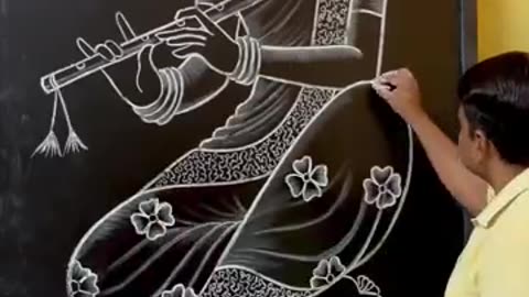 A beautiful girl painting on black board