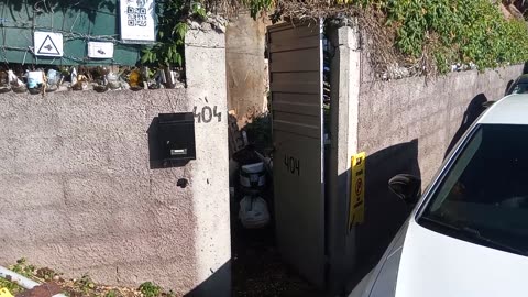 250211A___Madeira_NS-404,_garden_entrance_blocked_with_a_car.(1080p)