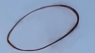 Shadow of Ezra - A massive black ring was seen hovering in the sky over a small town i...