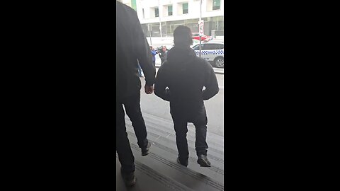 Jacob Hersant and Jim Roberts speak to a journalist after members of the National