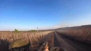 Wild Footage of Russian Soldiers Wiping Out While Trying to Shoot Drone from Back of Dirt Bike