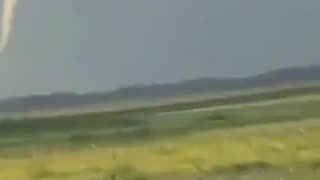 Tiny tornado on the ground in Crystal Lake, Iowa, a short time ago.