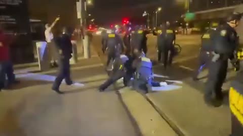 ICE sneak around to side and behind peaceful protester