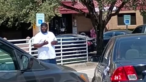 Black guys tries to save a handicap spot.