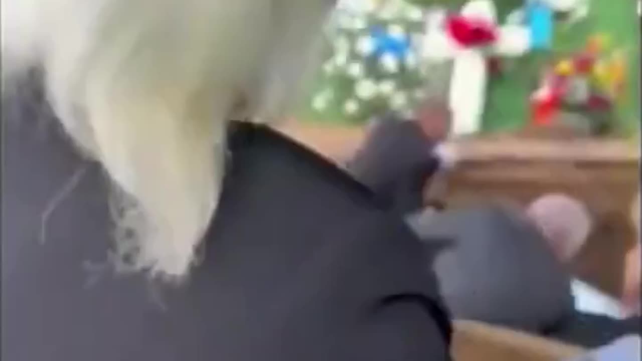 Deceased man's son gets trapped under his father's casket after a platform