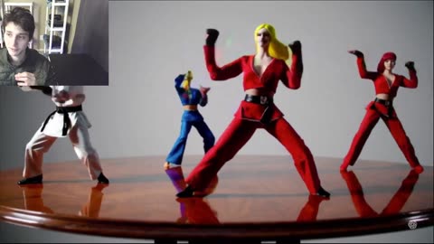 Action Figures Dancing In A Martial Arts Style Dance-Off On A Table Fake Stop Motion Video