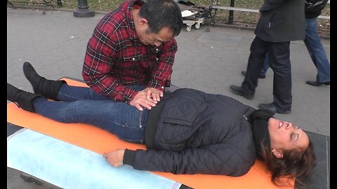 Luodong Massages Dark Skinned Woman At Washington Square Park