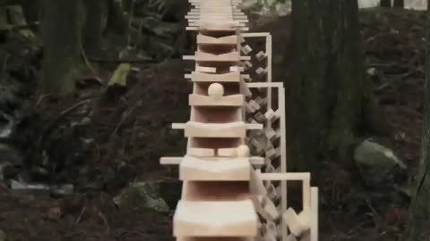 Enormous xylophone in the woods of Kyushu, Japan plays a Bach tune when a wooden ball rolls down each "key”