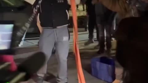 Anti-ICE in Minneapolis attempts to break open a law enforcement's weapon locker