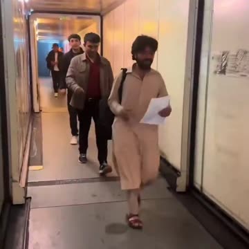 Afghans boarding a flight to the UK under the Afghan resettlement scheme