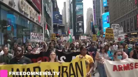 BREAKING Hundreds march through New York City Times Square demanding 'No war with Iran'.
