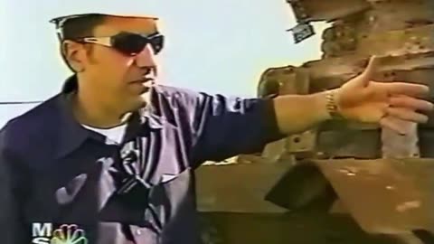 Bob Kelman, manager of a steel recycler, inspecting steel from the Twin Towers after 9/11.