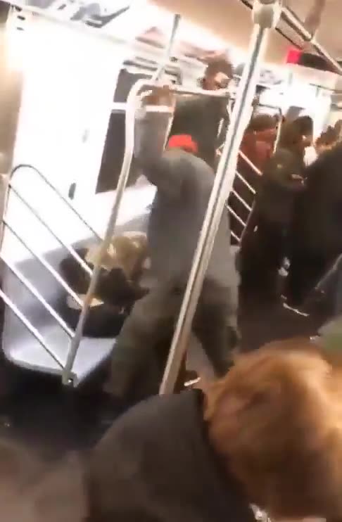 Two large Black men pummel a small white boy, then throw him off the subway/train.