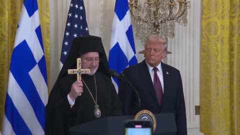 GREEK AUDIENCE CHEERS AS ARCHBISHOP HANDS TRUMP A HOLY CROSS AND SAYS HE IS THE NEW CONSTANTINE