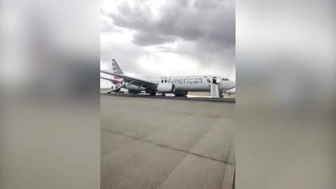 Passengers were seen evacuating an American Airlines plane on the runway of Denver Airport
