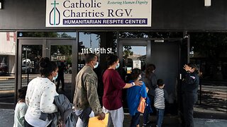 Catholic charities facilitate the mass migration