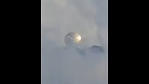 An enormous metallic UFO sphere was observed hovering above a volcano in Mexico.