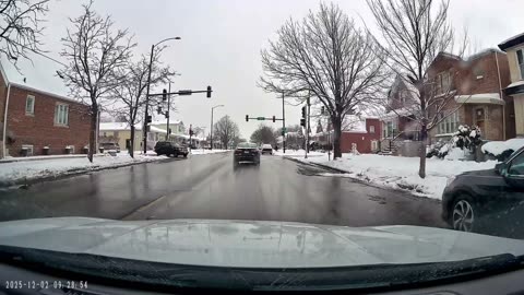 Impatient Chicago Driver Crashes Onto Snowy Sidewalk After Running Red Light