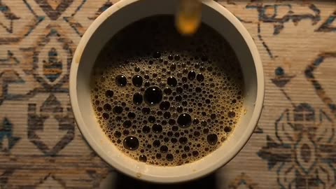 Savoring the Warmth: A Moment with a Cup of Coffee