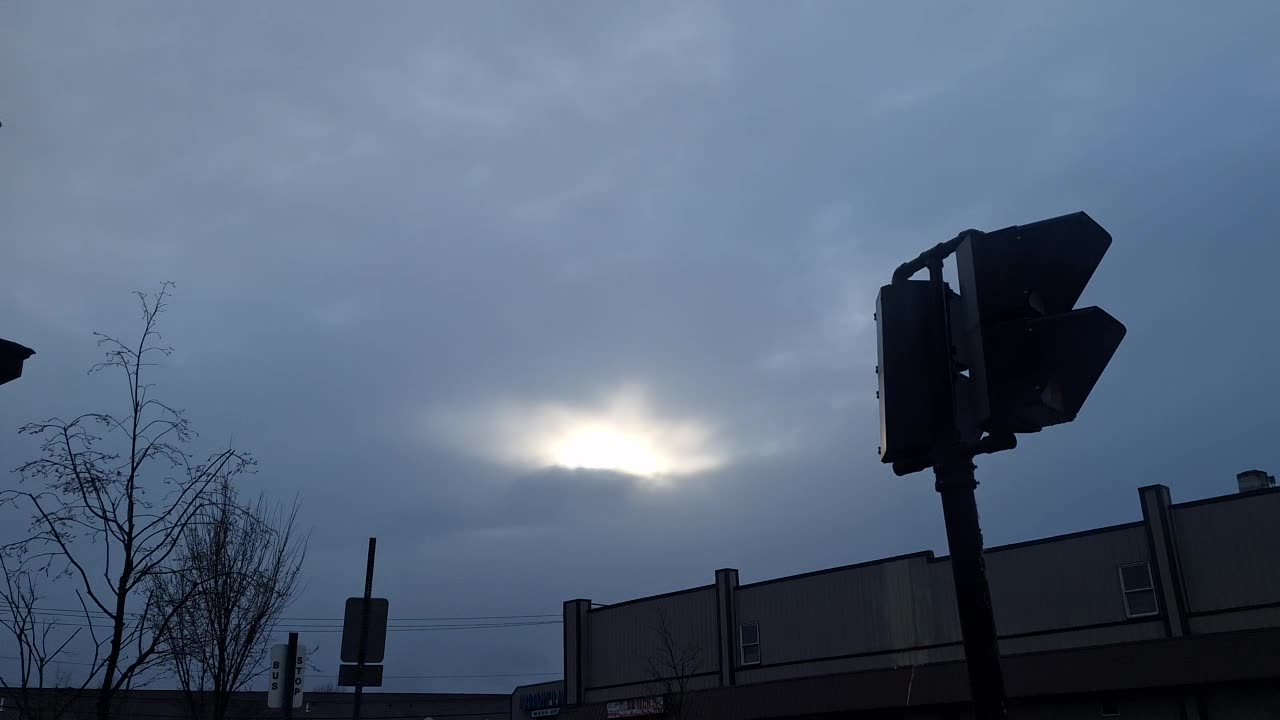 A break through the "clouds" to the real sky seeing the white sun and yellow sun!