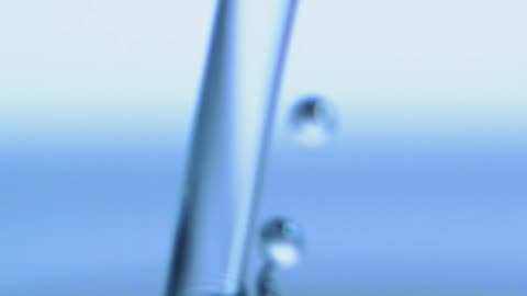 Very close view of a jet falling into a pool of water