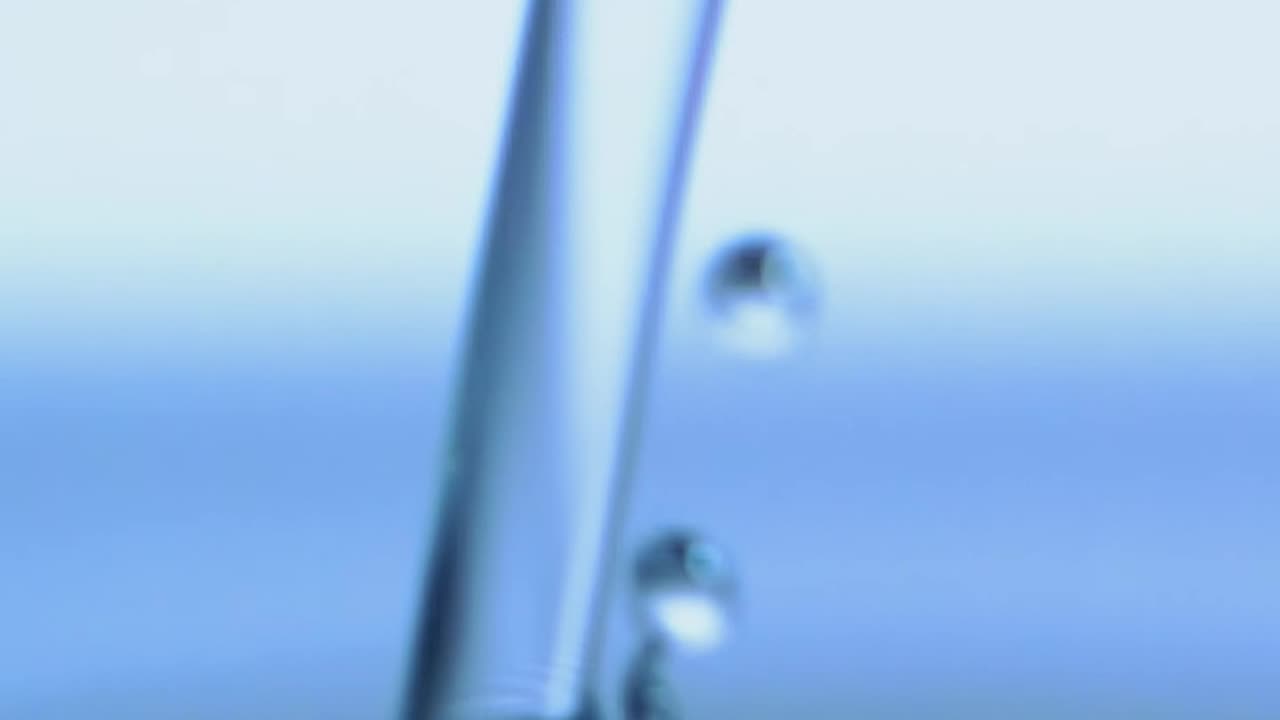 Very close view of a jet falling into a pool of water