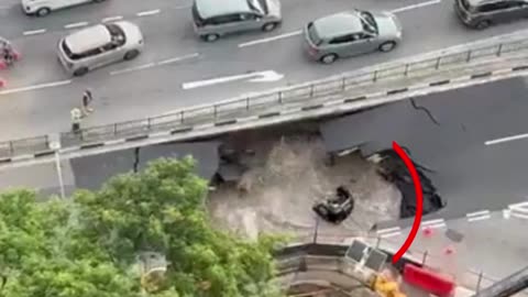 Car Swallowed by Massive Sinkhole on Busy Singapore Road — Woman Rescued Just in Time!