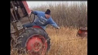 Man almost crushes himself when tractor flips, caught on camera