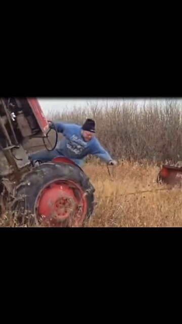 Man almost crushes himself when tractor flips, caught on camera