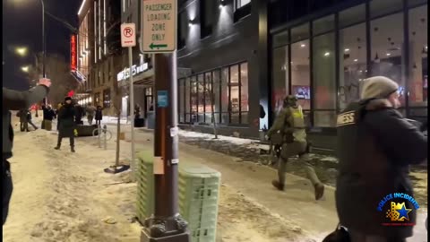 Anti-ICE protesters destroying sign of Home2Suites Hotel in Minneapolis,