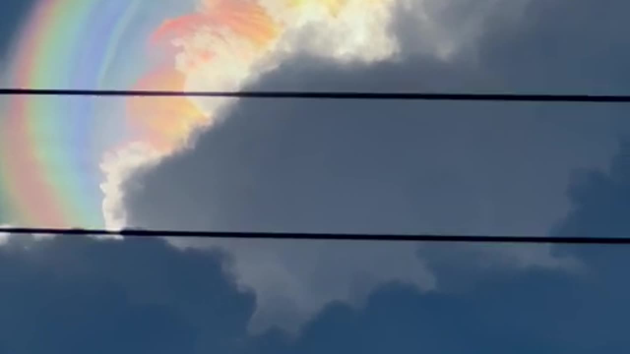 A Sun Halo Peeks Through Storm Clouds