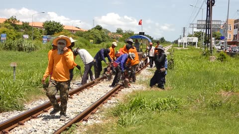 Railway Crew shoring up the ballast