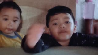 Grey and Isaiah watching on camera