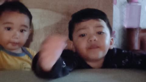 Grey and Isaiah watching on camera