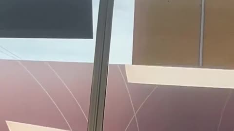 Strong winds hit a government office in Dubbo, New South Wales, smashing window