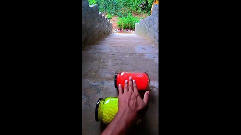 Incredible different colours of bottles falling from stairs to check hardness