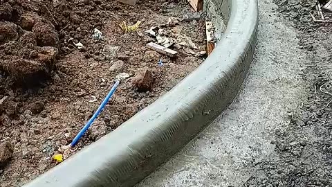 Workers Smooth Concrete With Wet Plastic