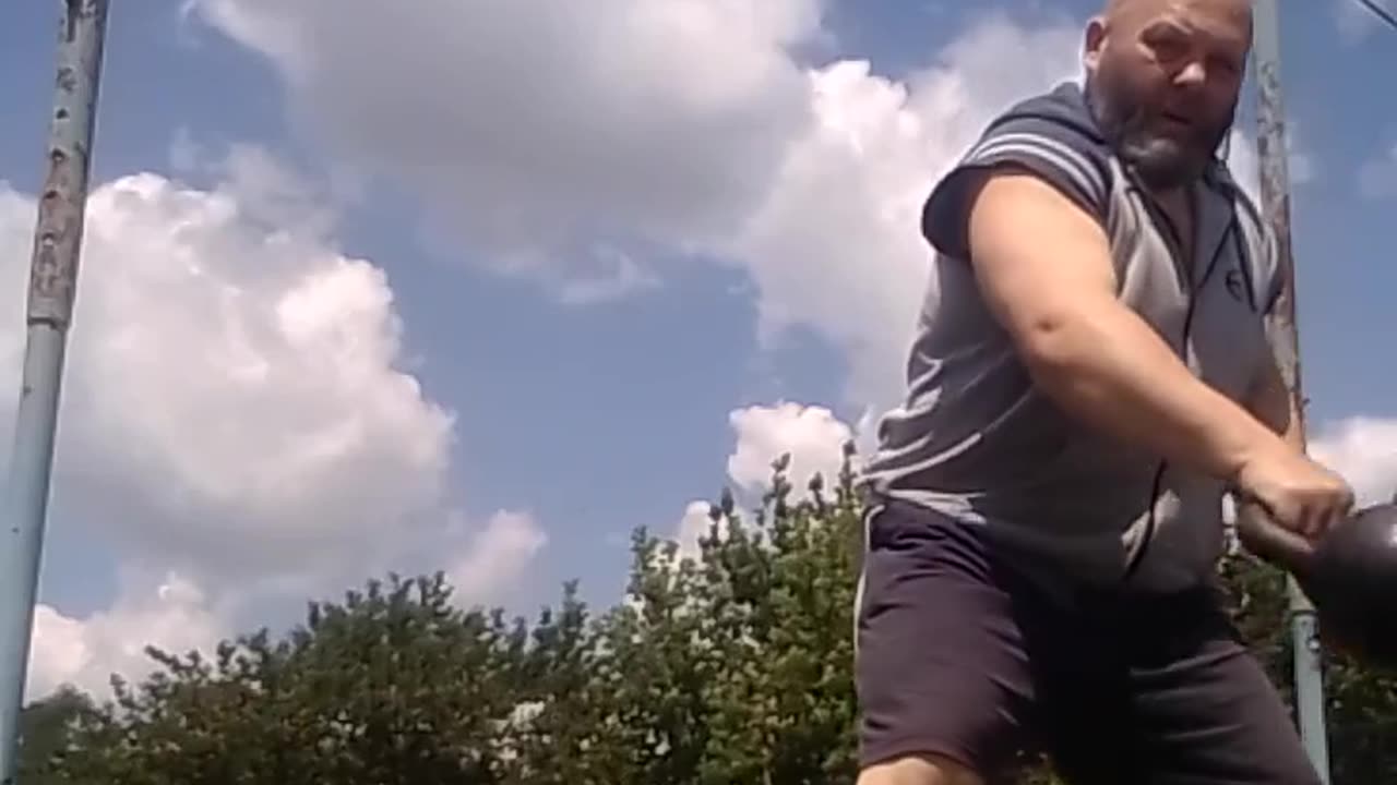 Throwing a kettlebell high over the crossbar