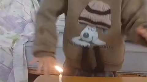 Radmehr blows out his birthday candle and dances to the music..