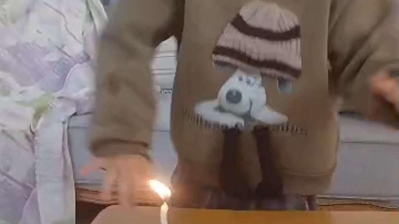 Radmehr blows out his birthday candle and dances to the music..