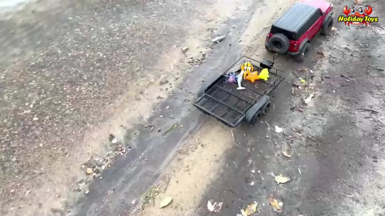 Red Car Carrying Seven Animals Sleeping in the Back