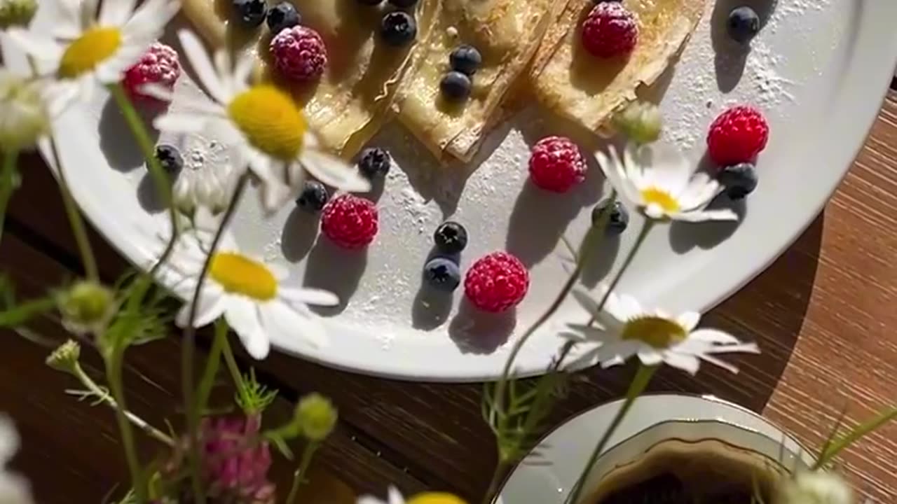 The pancakes are made with milk and served with fresh berries.