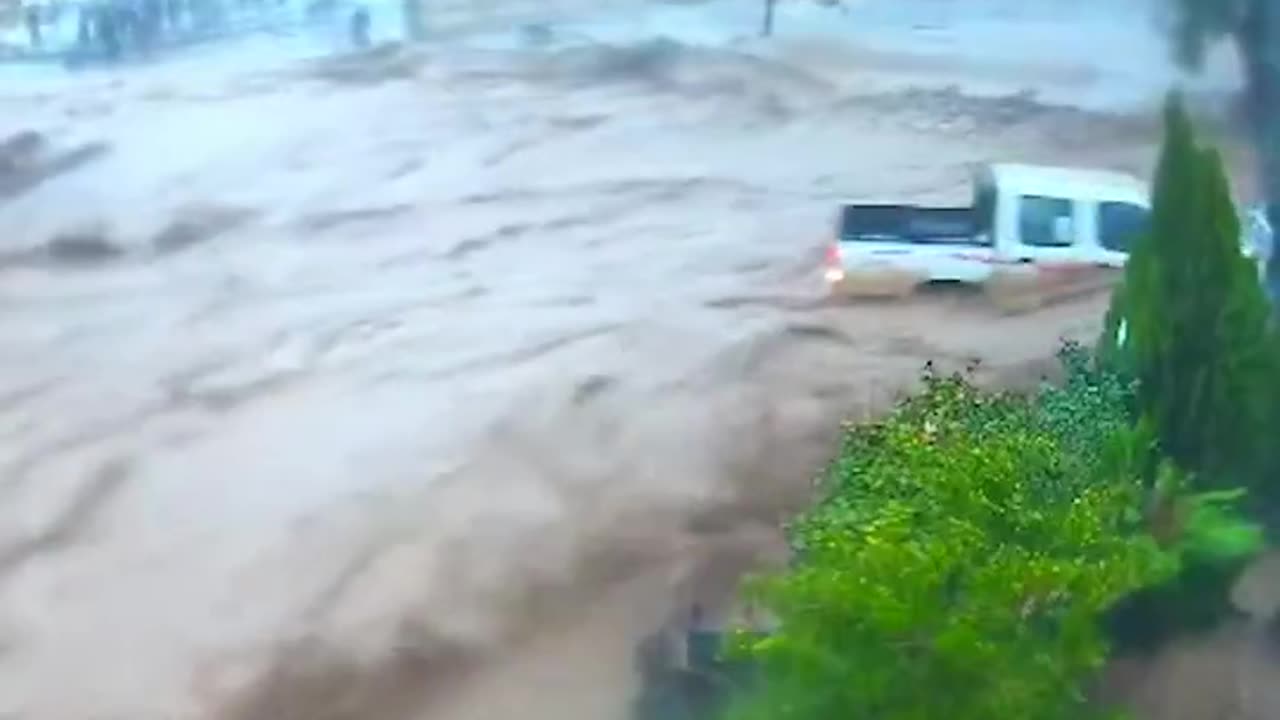 Wall collapses outside school during widespread flooding in Iraq