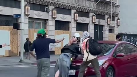 Woman ran over by an individual driving a car during protests in Los Angeles, California