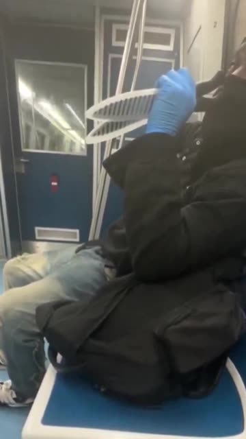 Black with knives on train