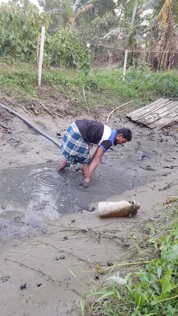 Hand fishing by village fisherman