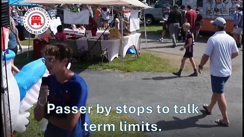 Passer by stops to talk term limits.