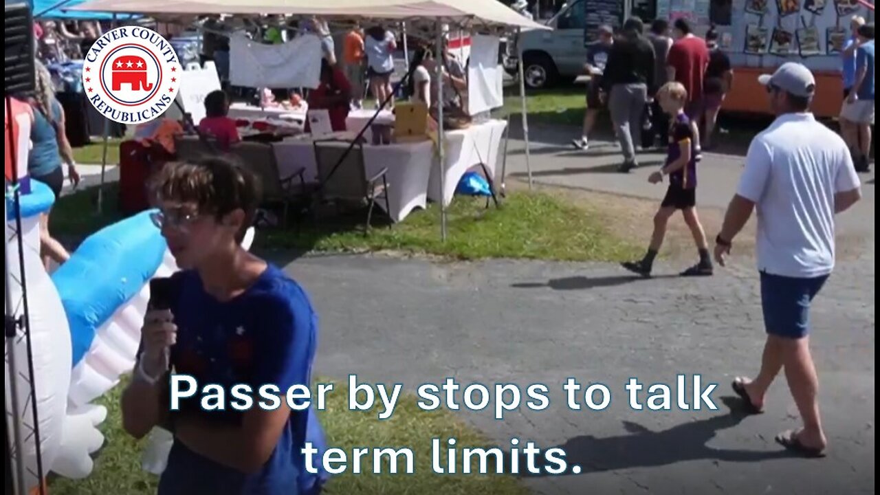 Passer by stops to talk term limits.